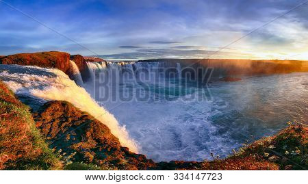 Fantastic Sunrise Scene Of Powerful Godafoss Waterfall. Dramatic Sky Over Godafoss. Location: Bardar