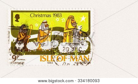 Seattle Washington - October 5, 2019: Used Isle Of Man Postge Stamp For Christmas 1983, With Stars, 