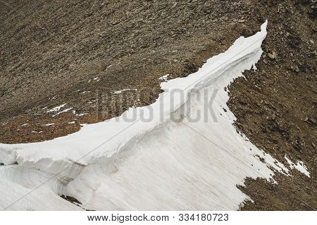 Atmospheric Textured Minimalist Alpine Landscape With Firn Or Snow On Big Combe Rocky Mountain Ridge