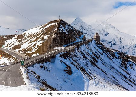 Austria. Grossglockner sightseeing road. The first snow fell on Grossglockner Alpine Road. The road consists of 36 serpentine turns. The roadside is fenced. Ecological and photo tourism concept