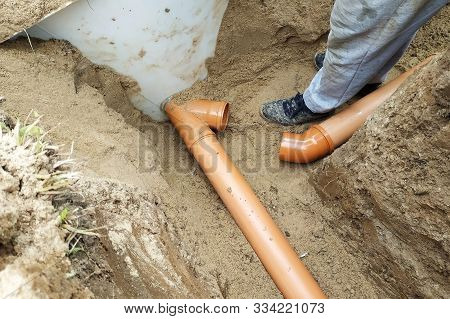 Supply Of A Sewer Pipe To A Sump By A Master Locksmith In The Countryside.