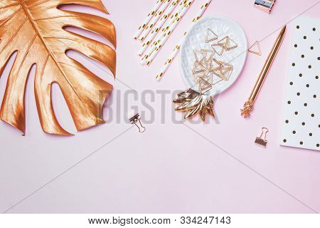 Golden Color Stationery And Decor On Pink Bacgkround, Top View.