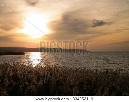 Beautiful View Of Sunrise Over Vistula Lagoon. Coast Close Frombork City.