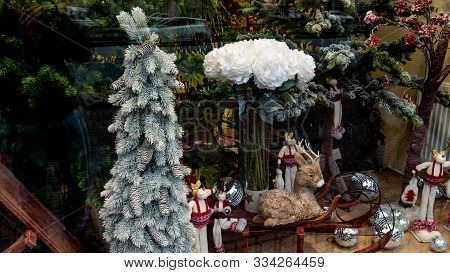 Beautiful Brown Christmas Deer Toy. Deer Sitting On The Sleigh Of Santa Clus. New Years Toys On The 