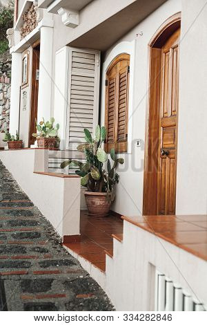 Flowerpots With Cactus Near House In Savoca, Italy