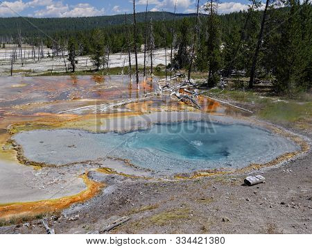 Medium Wide Shot Of Celestine Pool At Lower Geyser Basin, With Clear Skies At Yellowstone National P