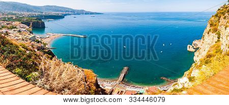 Panorama Of High Cliffs, Tyrrhenian Sea Bay With Pure Azure Water, Floating Boats And Ships, Pebble 