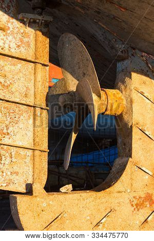 Detail Of A Propeller Of An Old Fishing Boat, Enligted By A Morning Sunligt. Port Of Essaouira, Moro