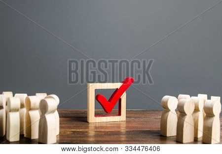 People Look At The Vot Checkmark. Voting In The Elections. Democratic Institutions Process, Poll And
