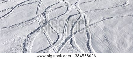 Snowy Off-piste Ski Slope With Trace From Skis And Snowboards At Sun Winter Day. Panoramic View.