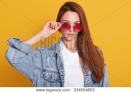 Close Up Portrait Of Young Woman In White Shirt Wears Sunglasses And Denim Jacket. Attractive Girl W