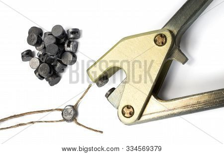 Lead Sealing Press With A Lead Seal And Twine. Isolated On A White Background.