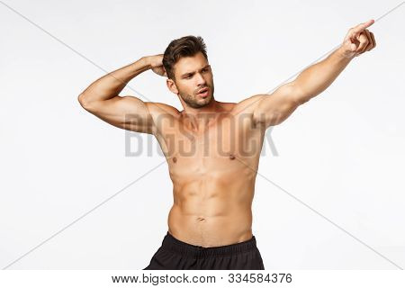 Sexy Masculine Man With Six Packs, Standing Bodybuilder Pose Naked Torso White Background, Raising H