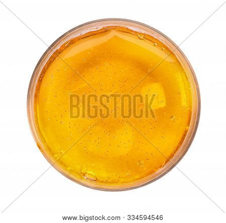 Orange Slime With Glitter In Plastic Container Isolated On White, Top View. Antistress Toy