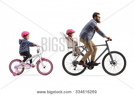 Father riding a bicycle with a child seat and a little girl riding a bicycle behind isolated on white background