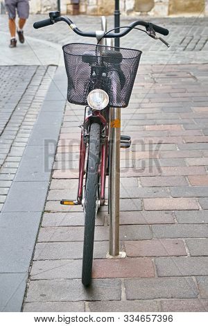 Front View Of The Vintage City Bicycle With The Black Basket On The Handlebar Outdoors. Concept Of T