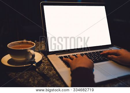 A Cup Of Cappuccino Coffee With Laptop White Screen On Table. Royalty High Quality Free Stock Photo 