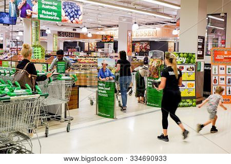 Sydney, Australia 08-31-2019: Entrance And Exterior View Of Woolworths Supermarket. Customers Enteri