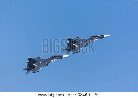 Pair Of Fighters Flying In Tight Formation