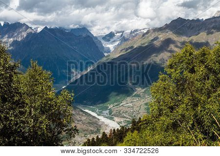 Aerial View From One Mountain To Mountain Shkhara And River Mestiachala Flowing From It