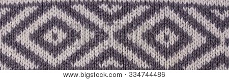 Background Of Grey Knitted Fabric. Home Made Stitchwork.