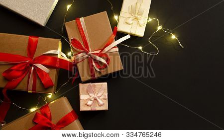 Gift Or Present Box With Red And Whight Bow Ribbon And On Garland On A Black Backgroundwooden Or Val