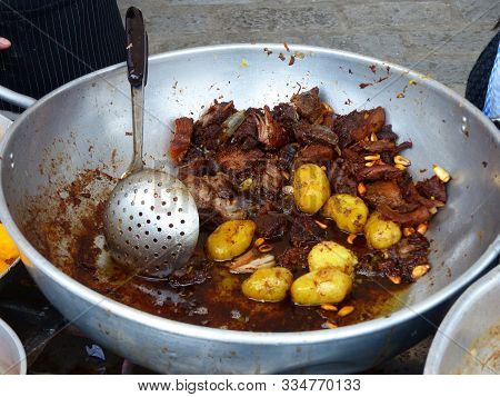 Big Metal Bowl Of Fritada, Fried Pork Meat With Corn, Tostado And Potatoes, Traditional Homemade Ecu