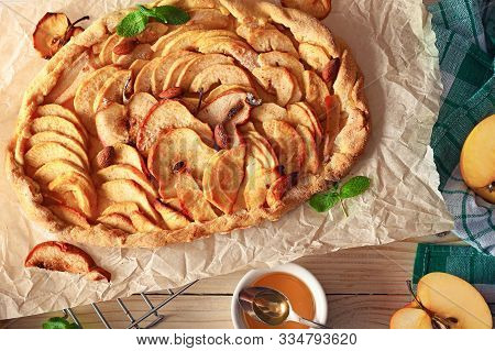 Traditional Apple Sliced Fruit Pie With Honey And Mint. Taten Apples And Pears On Craft Paper With A