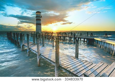 Lighthouse In Lake Neusiedl At Sunset. The Well Known Lake With Excelent Conditions For Kiteboarders