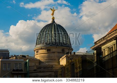 Dresden, Germany: The Building Of The Academy Of Arts With A Gold Sculpture At The Top.