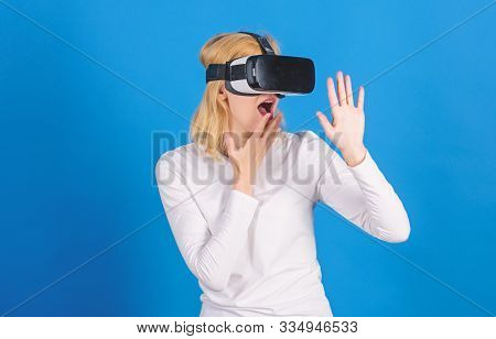 The Woman With Glasses Of Virtual Reality. Beautiful Woman Wearing Virtual Reality Goggles In Studio