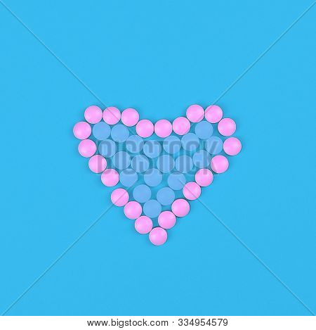 Medical Background. Dright Pink And Blue Pills In Form Of Heart On Blue Background. Flat Lay. Heart 