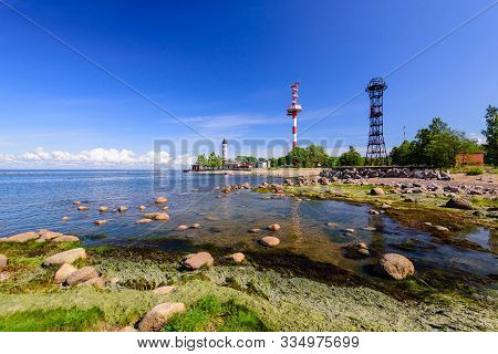 Shepelevsky Lighthouse On The Picturesque Coast Of The Gulf Of Finland. Beautiful Summer View Of The
