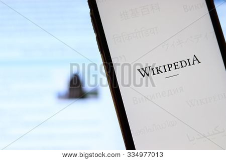 Los Angeles, California, Usa - 21 November 2019: Wikipedia Logo On Phone Screen With Icon On Laptop 