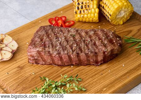 Roasted Striploin Steak With Grilled Corn, Garlic, Red Chili Pepper, Salt, Rosemary, Thyme. Deliciou