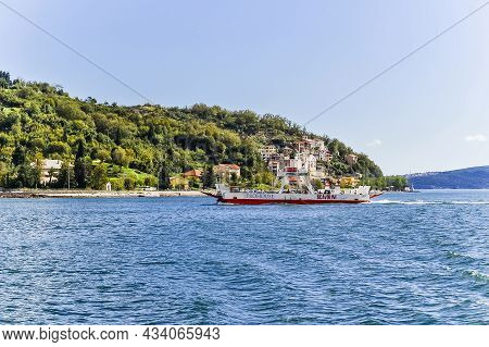 Kamenari, Montenegro - July 25, 2021: Beautiful View Of The Bay Of Kotor And Regular Passenger Ferry