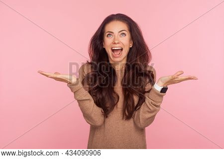 I Have No Idea. Portrait Of Excited Happy Young Woman With Brunette Wavy Hair Shrugging Shoulders In