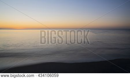 Beautiful Vibrant Late Summer Sunrise Over Pentewan Sands On English Cornwall Coast With Long Exposu
