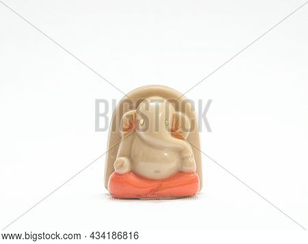 Hindu God Lord Ganesh Statue Isolated In A White Background
