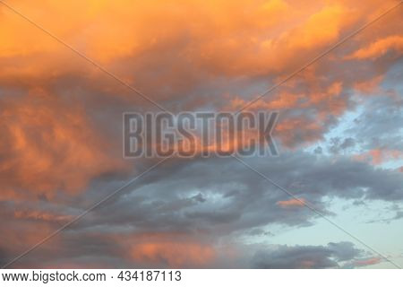 Romantic Sunset With Orange Clouds During A Summer Evening