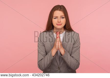 Please, I Need Help. Portrait Of Imploring Young Woman In Business Suit Praying, Begging With Naught