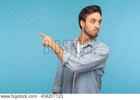 Get Out. Portrait Of Irritated Young Businessman In Casual Denim Shirt Pointing Away, Scolding For B