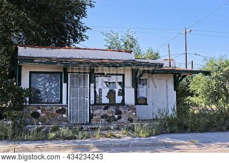 Abandoned Small Commercial Building With Blocked Out Windows