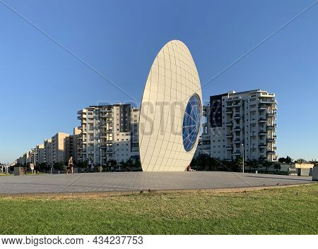 Ashdod, Israel - September 18, 2021: Hotel Leonardo And Urban Sculpture Eye Of The Sun On The Waterf