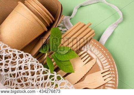 Close Up View Of Kraft Paper Food Cups, Plates And Containers With Wooden Cutlery And Drinking Paper