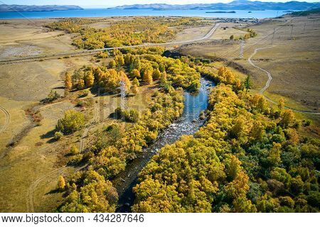 Autumn Landscape From The Air. Yellow Trees On The River Bank. Sarma River , Lake Baikal.