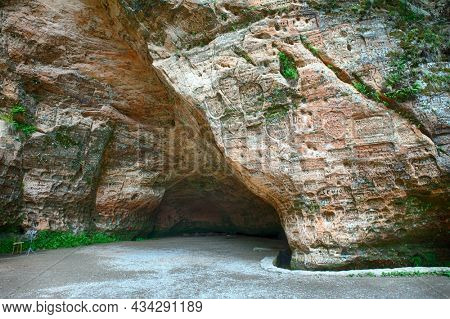 Gutmanis cave (Gutman's cave) is a landmark with inscriptions in sandstone from 17th century. Gauja national park. Sigulda, Latvia