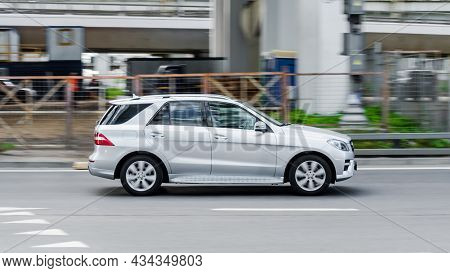 White Mercedes-benz Ml Class W166 Suv Car Moving On The Street Along Industrial District. Moscow, Ru