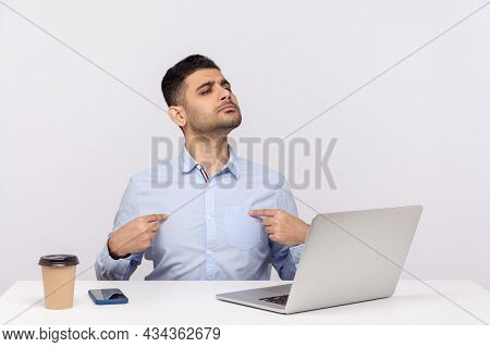 This Is Me. Arrogant Selfish Businessman Sitting Office Workplace With Laptop On Desk, Pointing Hims