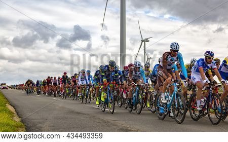 Le Gault-saint-denis, France - October 08, 2017: The Peloton Riding On A Road In The Plain With Wind